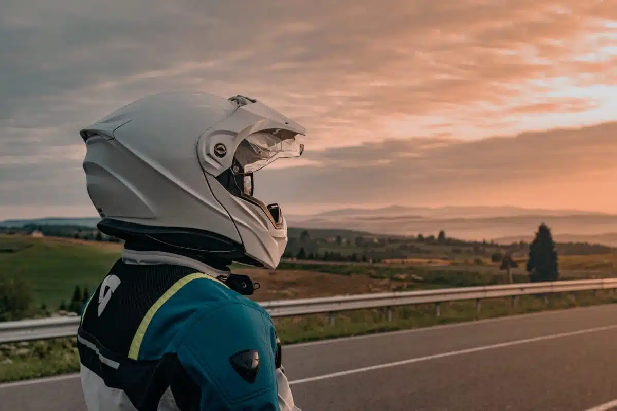 person in blue and white jacket wearing white helmet